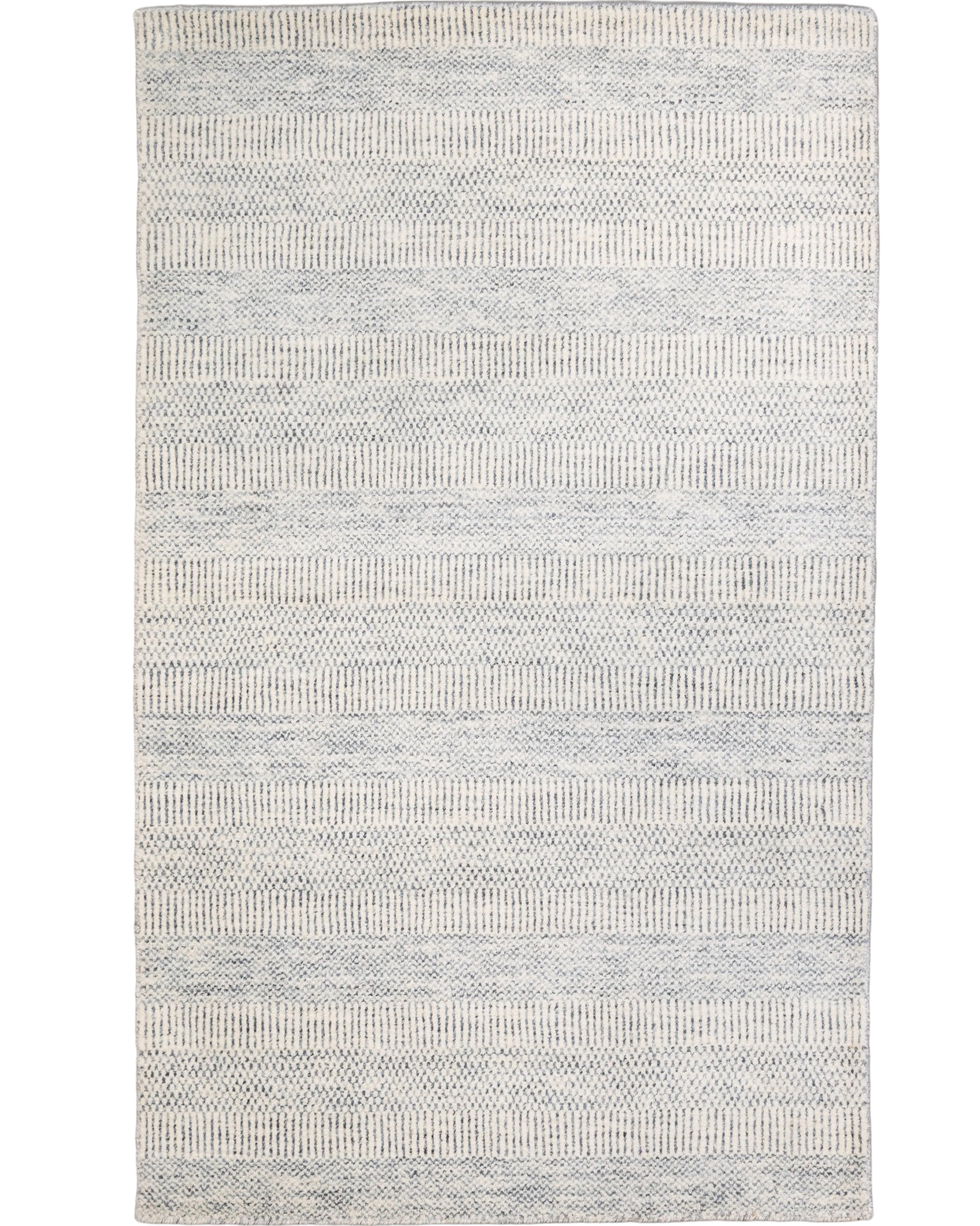 Hand-woven ivory and soft grey wool and bamboo silk rug with a tone-on-tone woven diamond and chevron pattern, 3' x 5', made in India.