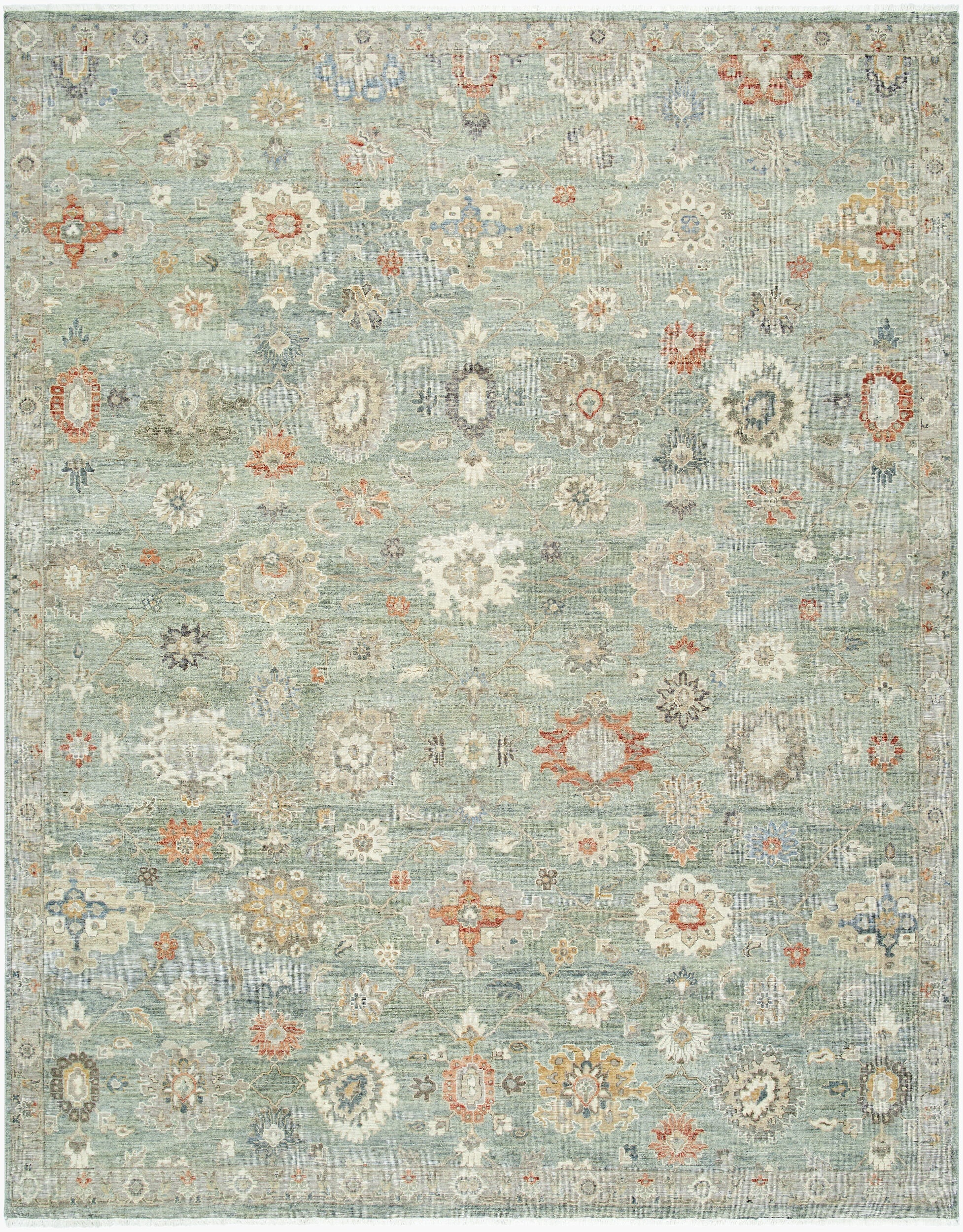 Hand-knotted sage green Indian wool rug with oversized Oushak-style floral lattice pattern.