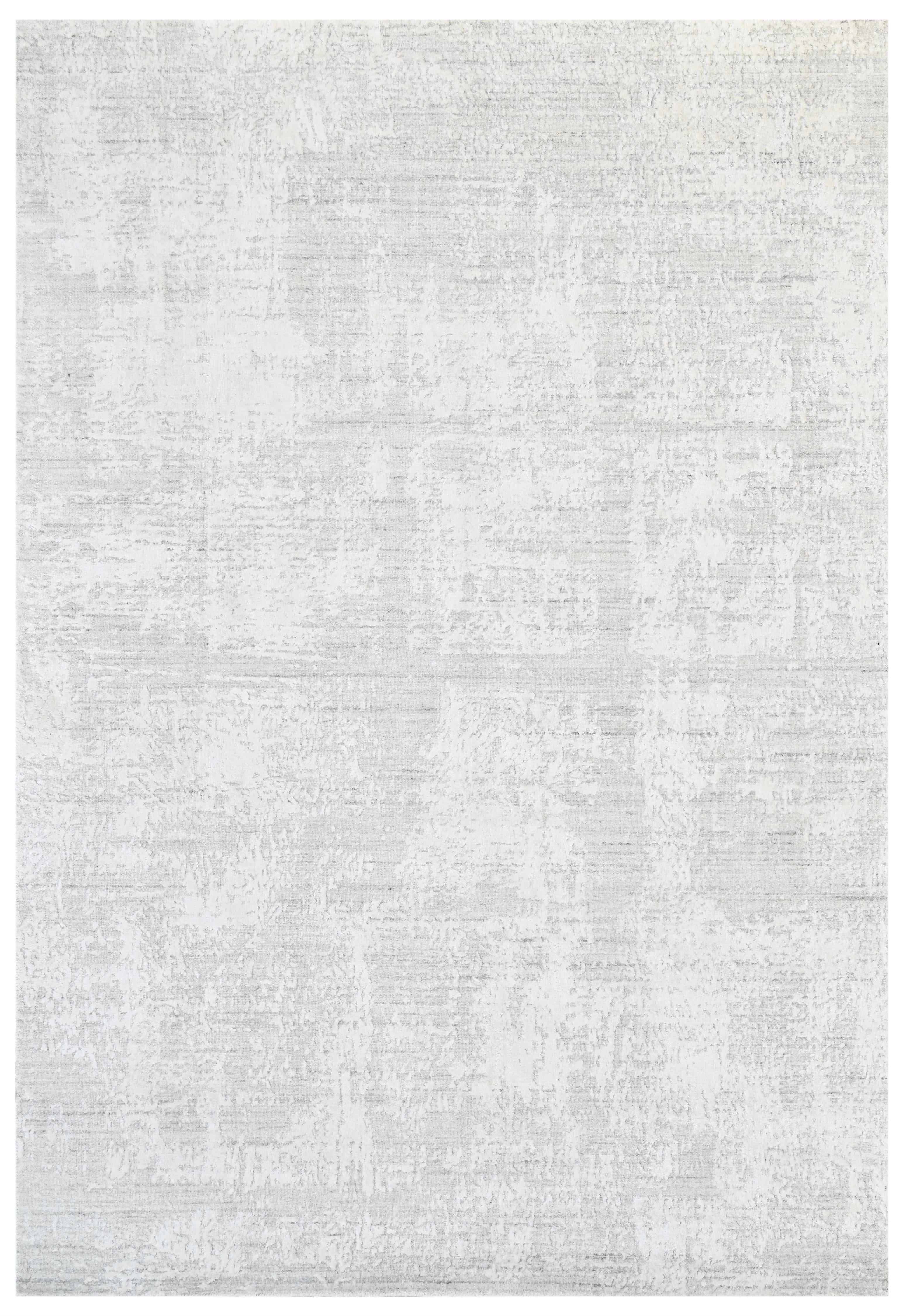 Handmade wool and bamboo silk Alpine rug in white and silver grey with an abstract tone-on-tone eroded texture pattern, made in India.