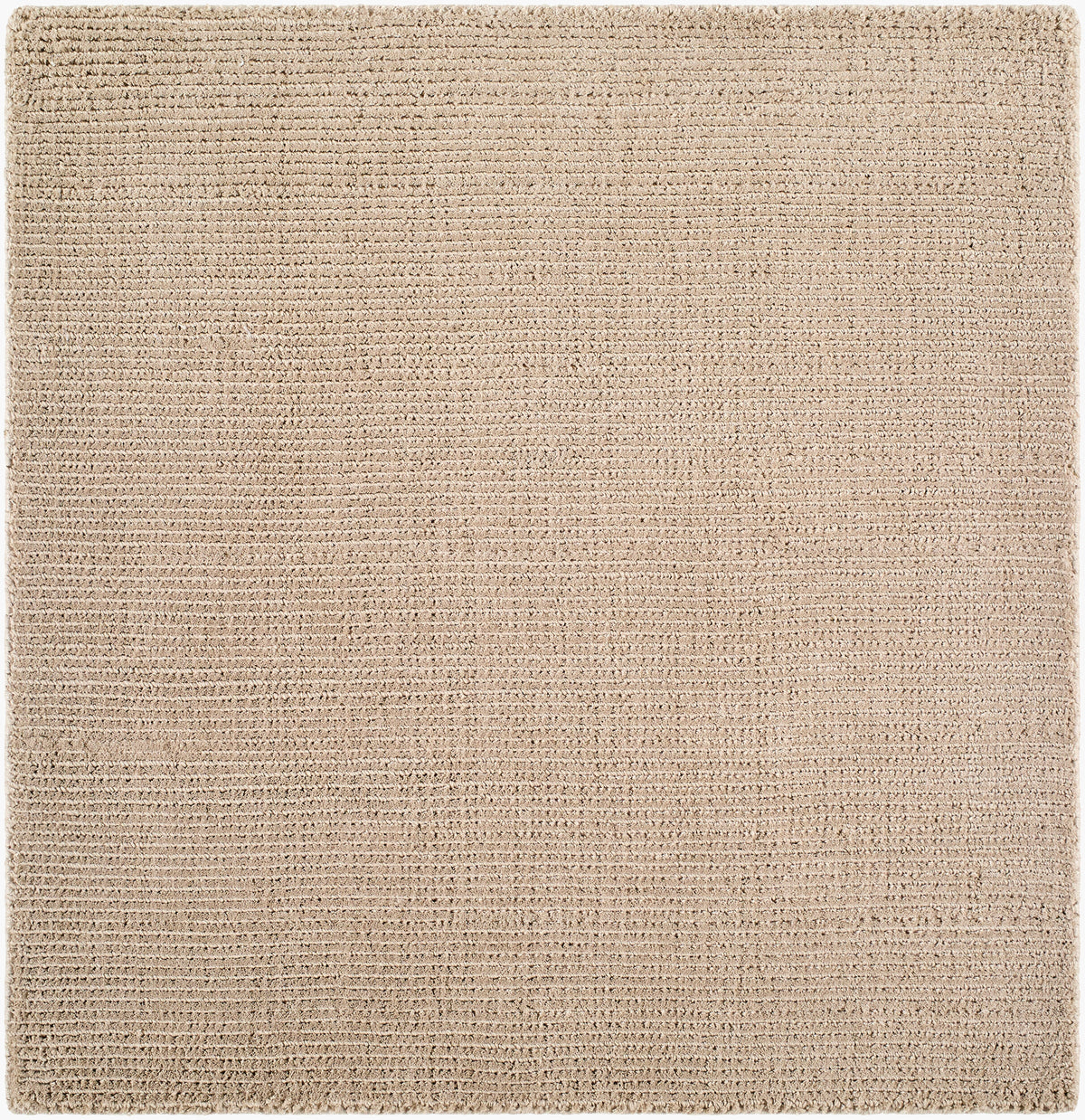 Solid beige handwoven P.E.T fiber rug with fine ribbed texture, available in multiple sizes.