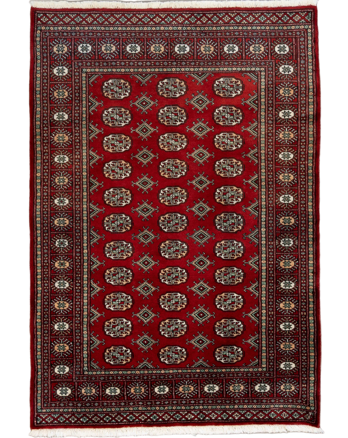 4' x 5'10" handknotted wool Bokhara rug from Pakistan with red field and traditional geometric pattern