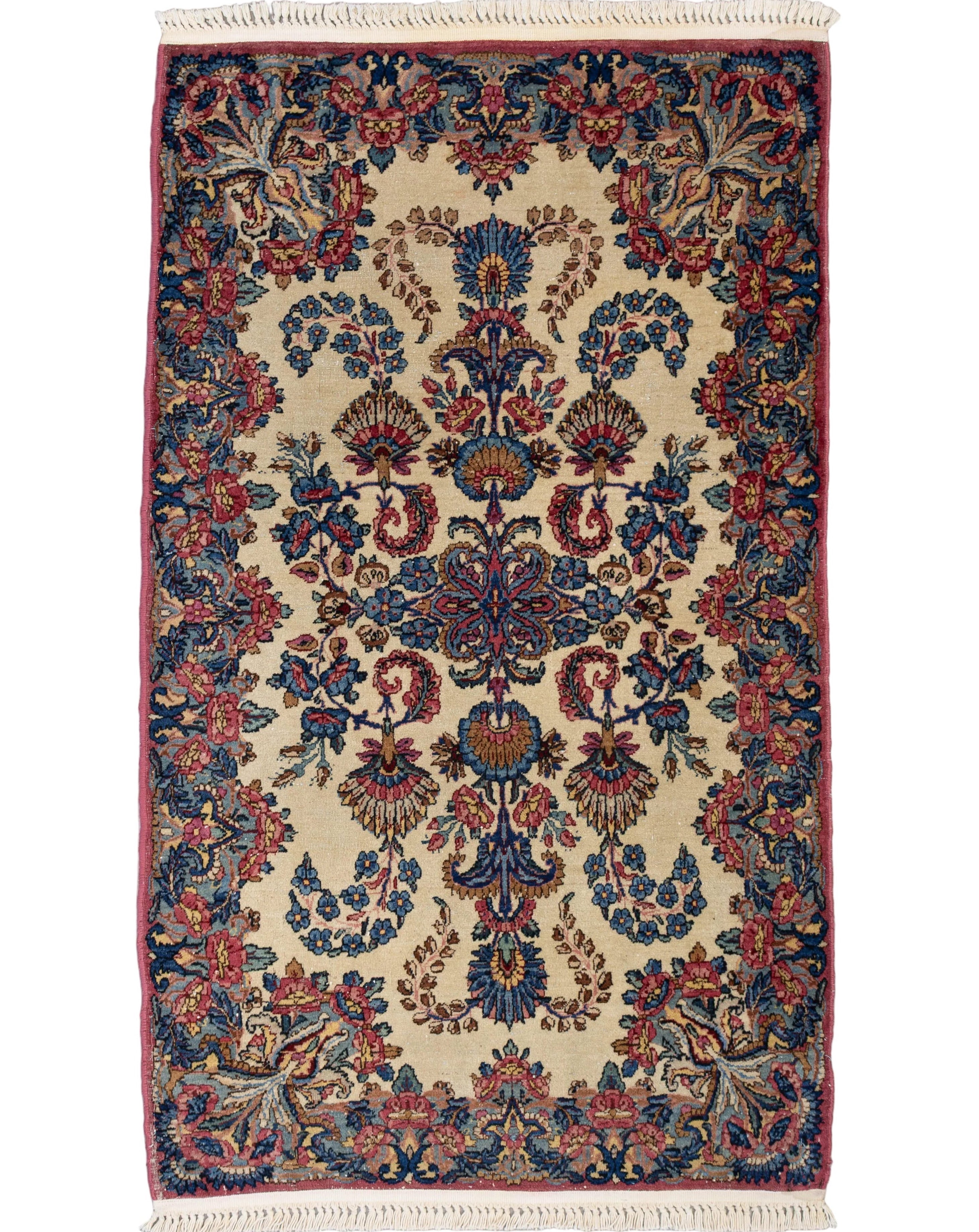 Hand-knotted ivory wool semi-antique Persian Kerman rug with rose and blue floral medallion pattern, 2'11" x 4'11".