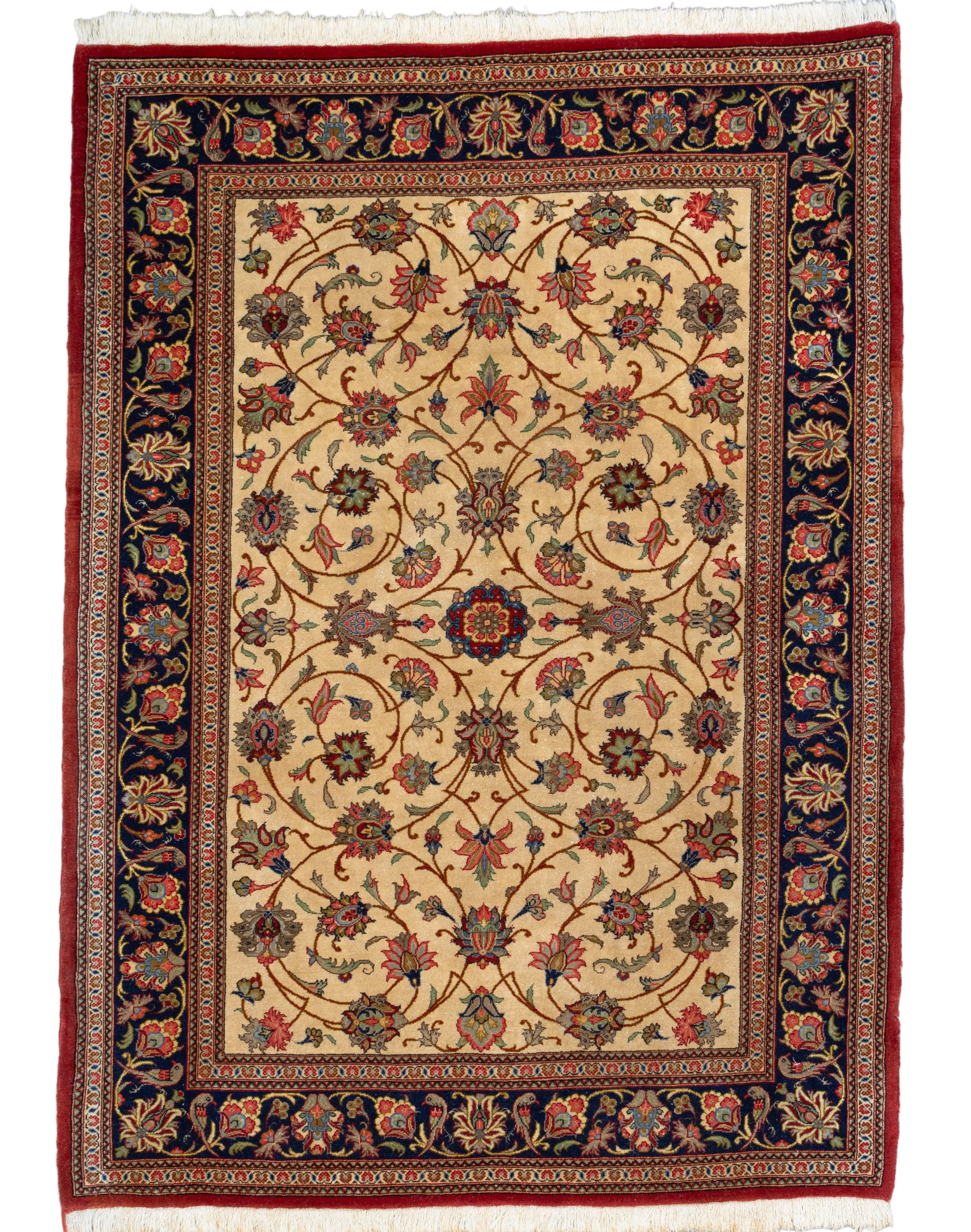 Fine hand-knotted Persian Qom wool rug in golden beige with an all-over vine lattice, multi-petalled rosettes, and a navy floral border, 3' x 5', made in Iran.