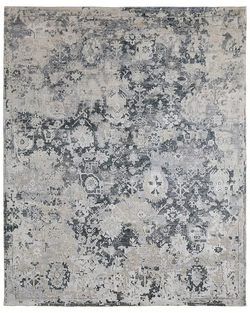 Hand-knotted gray wool and silk rug with distressed charcoal floral mosaic pattern, multiple sizes available.