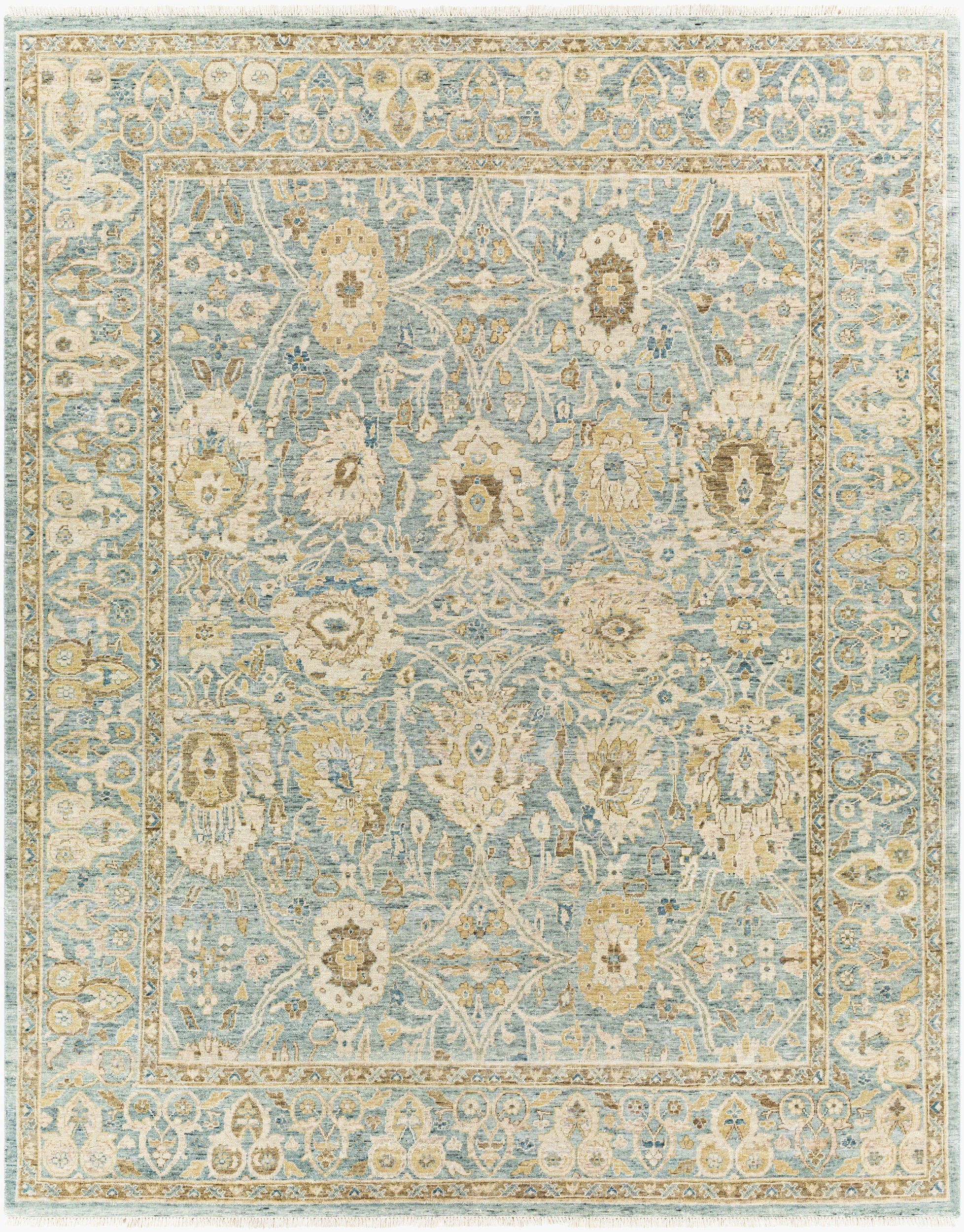 Seafoam blue handknotted wool rug with a faded gold and ivory floral medallion pattern, styled with a decorative bowl.